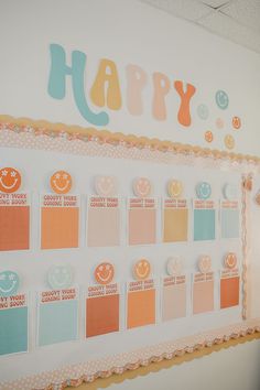 a happy birthday card displayed on a wall in an office space with lots of stickers