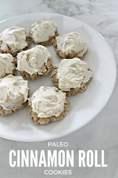 a white plate topped with cookies covered in frosting