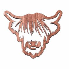 a wooden cutout of a bull's head with long hair and beards