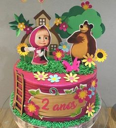 a birthday cake decorated with an image of masha and the bear