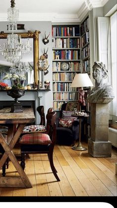 a living room filled with furniture and a large mirror