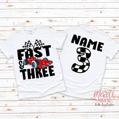 two t - shirts with racing cars and checkered flags on them, one is for the