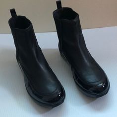 Never Used No Box Black High Ankle Moto Boots With Rubber Sole, Black Chelsea Boots With Leather Sole, Black Leather Sole Chelsea Boots With Closed Toe, Black Leather Sole Chelsea Boots, Black Closed Toe Chelsea Boots With Leather Sole, Black Ankle Moto Boots With Lug Sole, Black Leather Boots With Reinforced Heel, Black Moto Boots With Lug Sole, Black Moto Boots With Rubber Sole For Fall