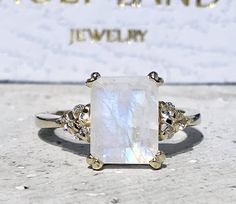 Don't miss this opportunity to own this beautiful gemstone ring crafted in 14k gold filled => Gemstone Type - Moonstone, Clear Quartz => Gemstone Cut - Faceted => Gemstone Size - 8*10 mm, 2 mm => Total Number of Gemstones - 7 => Metal Type - 14k Gold Filled (Tarnish Resistant And Nickel Free) - also available in 925 sterling silver * Please contact me for pricing on a sizes larger than 11 * ~ Feel free to ask me about custom made designs. ❏ Replacements and custom orders : ✪ 925 s Rectangular Moonstone Ring Gift, Rectangular Moonstone Ring For Anniversary, White Rings With Rectangular Stone For Gift, White Square Cut Ring As A Gift, White Square Cut Ring As Gift, White Rectangular Jewelry For Anniversary, White Rings With Rectangular Stone For Promise, White Crystal Ring With Gemstone Accents For Gift, White Rectangular Rings With Center Stone