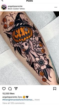 a person with a tattoo on their leg and some pumpkins in the sky above them