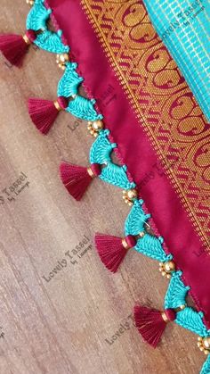 Lovely Tassel Work by Lavanya | Designer Double Step Tassel Work💙Notes👇 •8 Strands of silk thread for Crochet base •Crochet Needle no. 9 •4 chain base •6 strands of silk... | Instagram Saree Kutch, Crochet Base, Work Notes, Tassels Designs, Netted Blouse Designs, Designer Tassels