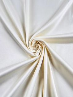 Indulge in the luxurious feel of this 58"/60" wide (147/152 cm) Silk Skin Duchess fabric, also known as Peau de Soie. Its dull satin finish and lightweight drape make it a perfect choice for creating elegant bridesmaid dresses, formal gowns, or any special occasion attire. With a subtle sheen and smooth texture, this high-quality silk fabric offers a sophisticated look and feel. Whether you're a professional dressmaker or an avid sewing enthusiast, this versatile material will elevate your projects with its timeless beauty and exceptional craftsmanship. Elevate your sewing experience and create stunning garments that will turn heads with this premium Silk Skin Duchess fabric. Luxurious Fabric: Crafted from exquisite peau de soie silk, this fabric offers a dull satin finish and a smooth, su Duchess Fabric, Bridesmaid Dresses Formal, Elegant Bridesmaid Dresses, Duchess Satin, Elegant Drapes, Matte Satin, Dresses Formal, Smooth Texture, Formal Gowns