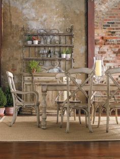 an old fashioned dining room table with chairs