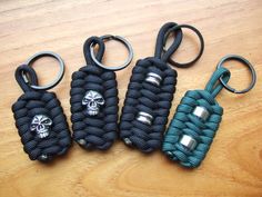 four paracorine key chains with skulls on them