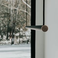 an open window with a view of the snow outside