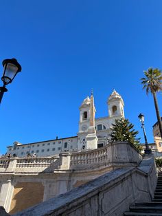 the stairs lead up to an ornate building