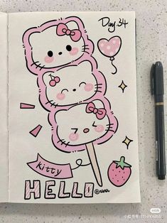 the hello kitty drawing is next to a pen