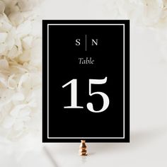 a black and white wedding table number card