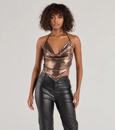 Flashy and fierce, level up your going-out look with this metallic foiled knit crop top! It features a sleeveless draped cowl neckline, halter spaghetti straps with a tie-back design, an alluring open back with lower tie-back straps, and a cropped hanky hem.Fit & FeaturesMetallic foiled knit fabric, plenty of stretchCowl necklineHalter spaghetti straps, tie-back designOpen back, lower tie-back strapsCropped hanky hemForm-hugging fitRuns true to size Trendy Metallic Tops For Party Season, Metallic Fitted Trendy Crop Top, Trendy Fitted Metallic Crop Top, Glamorous Metallic Tops For Club, Glamorous Metallic Club Tops, Metallic Cropped Top For Night Out, Metallic Cropped Top For Club, Chic Fitted Metallic Crop Top, Metallic Stretch Tops For Party Season