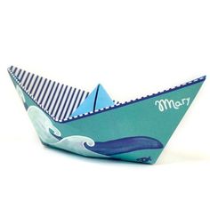 an origami boat with the word mom on it's front and side