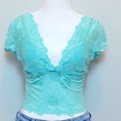 Bebe Beautiful Summer Turquoise Lace Crop Corset Woman Top, Plunging Neckline, Adjustable Fit With Three Lines Of Hook Closure, Cap Sleeves. Can Be Dressed Up With A Blazer Wide Lag Pants And Kitten Heels Or Cute Skirt Or Dress Down With Jeans. Pretty And Versatile. Size: Medium Condition: New With Tags The Item Will Be Shipped As Shown In All The Photos, Please See Every Photo For Exact Item Description. Ships From A Smoke Free Home Please See All Photos For Exact Item Condition Thanks For Visi Fitted Blue Lace Top, Blue Fitted Lace Top, Low-cut Blue Summer Tops, Blue V-neck Tops With Built-in Bra, Fitted Light Blue Lace Tops, Fitted Turquoise Tops For Spring, Turquoise Lace, Woman Top, Cute Skirts