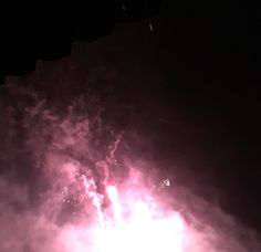 fireworks are lit up in the night sky