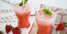 two glasses filled with watermelon and strawberries