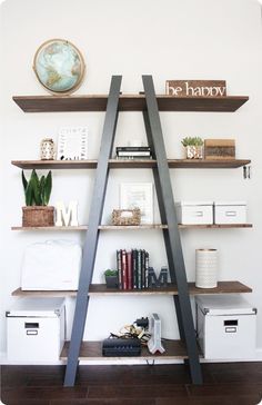 an open book shelf with books and other items on it, along with the words be happy