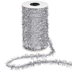 a spool of tinsel on a white background