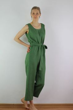 "Linen jumpsuit with belt and 2 pockets in green color, perfect for casual wear and suitable for any occasion in any season Details: - 100% natural linen produced in Europe ; - medium weight (180 gram per square meter); - color: green, could be any from our colors catalog (color samples at the photo); Made to order, approximately a few days, If you have any questions please message me and I will be glad to answer. Size guide : Size XS Bust: fits bust around 33\"-34\"/ 84-88 cm Waist: fits waist Green Linen Casual Jumpsuits And Rompers, Casual Green Linen Jumpsuits And Rompers, Green Linen Jumpsuits And Rompers For Spring, Spring Green Linen Jumpsuits And Rompers, Casual Linen Belted Jumpsuits And Rompers, Summer Green Belted Jumpsuits And Rompers, Green Belted Jumpsuits And Rompers For Summer, Casual Green Jumpsuits And Rompers With Tie Waist, Green Tie Waist Jumpsuit For Work