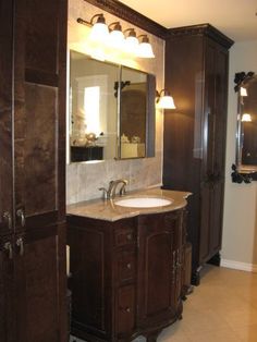 a bathroom with a sink and cabinets in it