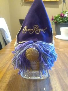 a purple hat sitting on top of a wooden table