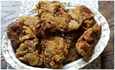 some fried food in a white bowl on a table