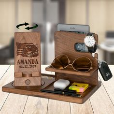 a wooden case with sunglasses and other items