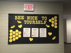 a bulletin board with bees and honeycombs on it