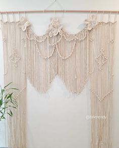 macrame wall hanging with flowers and leaves