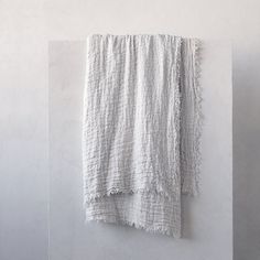 a white towel hanging on the wall