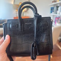 Purchased For $500 On Posh. Please See Pics In My Album For Current Condition Pictures Vs Conditions Prior To My Purchase. Pics Of Authenticity Via Posh Are Included. I Love This Purse But I Sadly Haven’t Gotten Much Use Out Of It. There’s A Small Snag On The Pocket Inside (Which Existed When I Bought It Previously). Otherwise It’s In Good Condition, And A Rare Find At This Price. Questions? Leave A Comment Below! High-end Black Pouch Satchel, Designer Black Pouch Satchel, Everyday Luxury Black Bag With Adjustable Strap, Luxury Everyday Black Shoulder Bag With Handle Drop, Everyday Luxury Black Satchel Bag, Luxury Everyday Black Satchel With Top Carry Handle, Black Luxury Tote Satchel For Everyday, Saint Laurent Bags, Toy Bags