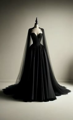 a black wedding dress with a long veil on it's head and neckline