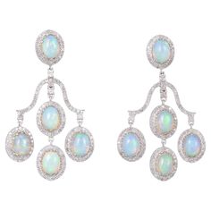 925 Sterling Silver Diamond Opal Earring Gross Weight: 22.380 14k Gold Weight: 2.520 Cts. Silver Weight: 16.410 gms Diamond Weight: 3.75 Cts. Opal Weight: 13.50 Dimension: Size- 55x35 mm Opal Earring, Diamond Chandelier Earrings, Fire Opals Jewelry, Diamond Jewel, Diamond Dangle Earrings, Jewelry Accessories Ideas, Sterling Silver Dangle Earrings, Opal Earrings, Modern Earrings