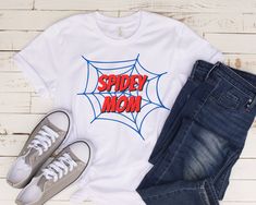 Spidey Mom T-Shirt | Women's Spiderman Shirt | Spiderman Birthday Party Shirt | Women's Spidey Shirt | Minimalist Spiderman Shirt | Spiderman Shirt for Moms | Mom's Spidey and his Amazing Friends Shirt | Simple Spiderman Shirt for Moms | Girls Spiderman Shirt This classic unisex jersey short sleeve tee fits like a well-loved favorite. Soft cotton and quality print make users fall in love with it over and over again. These t-shirts have-ribbed knit collars to bolster shaping. The shoulders have t Spidey And His Friends Birthday Party, Minimalist Spiderman, Spider Man Birthday Shirt Ideas, Cricut Spiderman Shirt, Spiderman Birthday Party Family Shirts, Spiderman 3rd Birthday Shirt, Spiderman Birthday Party Food, Spidernan Birthday Shirt, Diy Birthday Shirt