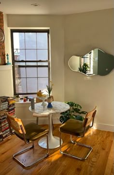 the room is clean and ready to be used as a home office or dining area