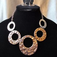 Silver Textured Necklace And Earring Set. Nickel-free Metal Jewelry Sets For Party, Elegant Circular Alloy Jewelry, Elegant Circle-shaped Alloy Jewelry, Multi Necklace, Brown Necklace, Purple Necklace, Red Necklace, Brass Necklace, Necklace And Earring Set