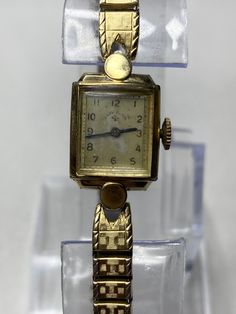 "Here's an absolutely beautiful lady Elgin mechanical wind watch. The case if 14k gold filled, and looks like real gold. The watch runs well and keeps good time. There is some wear and the crystal is a touch foggy. The bracelet is just over 6\" and could easily fit up to a 7\" wrist  Please message me with any questions" Luxury Vintage Jewelry And Watches As Gifts, Antique 14k Gold Watches, Antique Gold Rectangular Jewelry And Watches, Vintage 14k Gold Watches For Wedding, Vintage 14k Yellow Gold Jewelry And Watches, Vintage 14k Gold Wedding Watches, Antique Gold Bracelet For Formal Occasions, Gold Art Deco Wedding Watch, Collectible Vintage Gold Jewelry And Watches