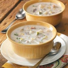 two bowls filled with soup on top of a table