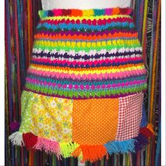 multicolored crocheted skirt on mannequin