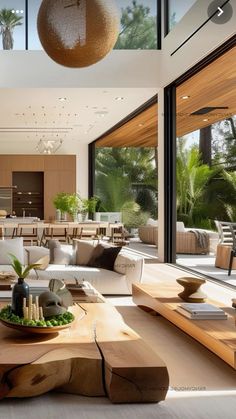 a living room filled with furniture and lots of windows