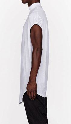 PLEASE KEEP IN MIND **Item takes up to 1-3 business weeks for production and 100% handmade ** **-** Details Exclusively Ours! Sleeveless draping oversize tank top in White/Black. Ribbed trim at turtleneck collar, armscyes, and accent stripe at back. Raw edges at hem. Tonal stitching. Body: 100% Viscose Cotton Dry clean. Made in TURKEY ** Men in the picture wearing size : Medium MEASUREMENTS XSMALL Bust: 48 cmLenght: 88 cm SMALL Bust: 50 cmLenght: 90 cm MEDIUM Bust: 52 cmLenght: 92 cm LARGE Bust: White Oversized Sleeveless Top, Oversized White Sleeveless Top, Oversized Sleeveless Tops For Layering, Oversized Summer Tops With Curved Hem, Oversized Sleeveless Cotton Tops, Oversized Tops With Curved Hem For Summer, Summer Loungewear Tops With Curved Hem, Everyday Summer Tops With Curved Hem, Everyday Summer Top With Curved Hem