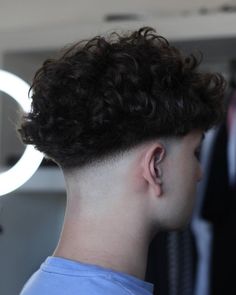 The Best V-Shaped Haircuts for Men Short Curly Taper Fade, Curly Undercut Mens, Low Fade Long Hair, Low Fade Haircut Men's, Low Fade Curly Hair, V Shaped Haircut, Fade Haircut Curly Hair, Mid Fade Haircut, Taper Fade Curly Hair