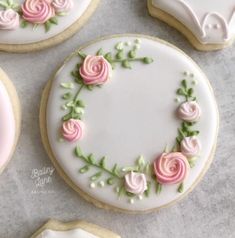 decorated cookies with pink and green flowers on them