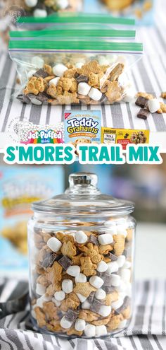 there is a jar full of cookies and marshmallows on the table with text overlay that reads s'mores trail mix