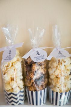 three bags of popcorn sitting on top of a shelf