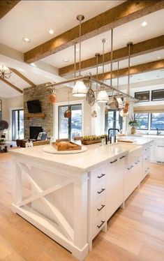 a large open kitchen with an island in the middle and lots of counter space around it