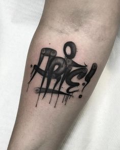 a black ink tattoo on the leg of a man's arm that says rip