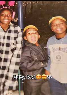 three young boys standing next to each other